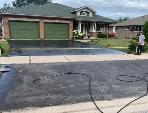 Before sealcoating: double driveway sealed for a lasting finish in Penetanguishene, Ontario